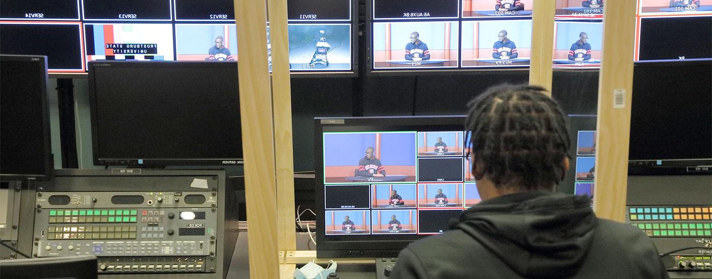 A Frostburg student works in a TV Studio watching various feeds from the cameras
